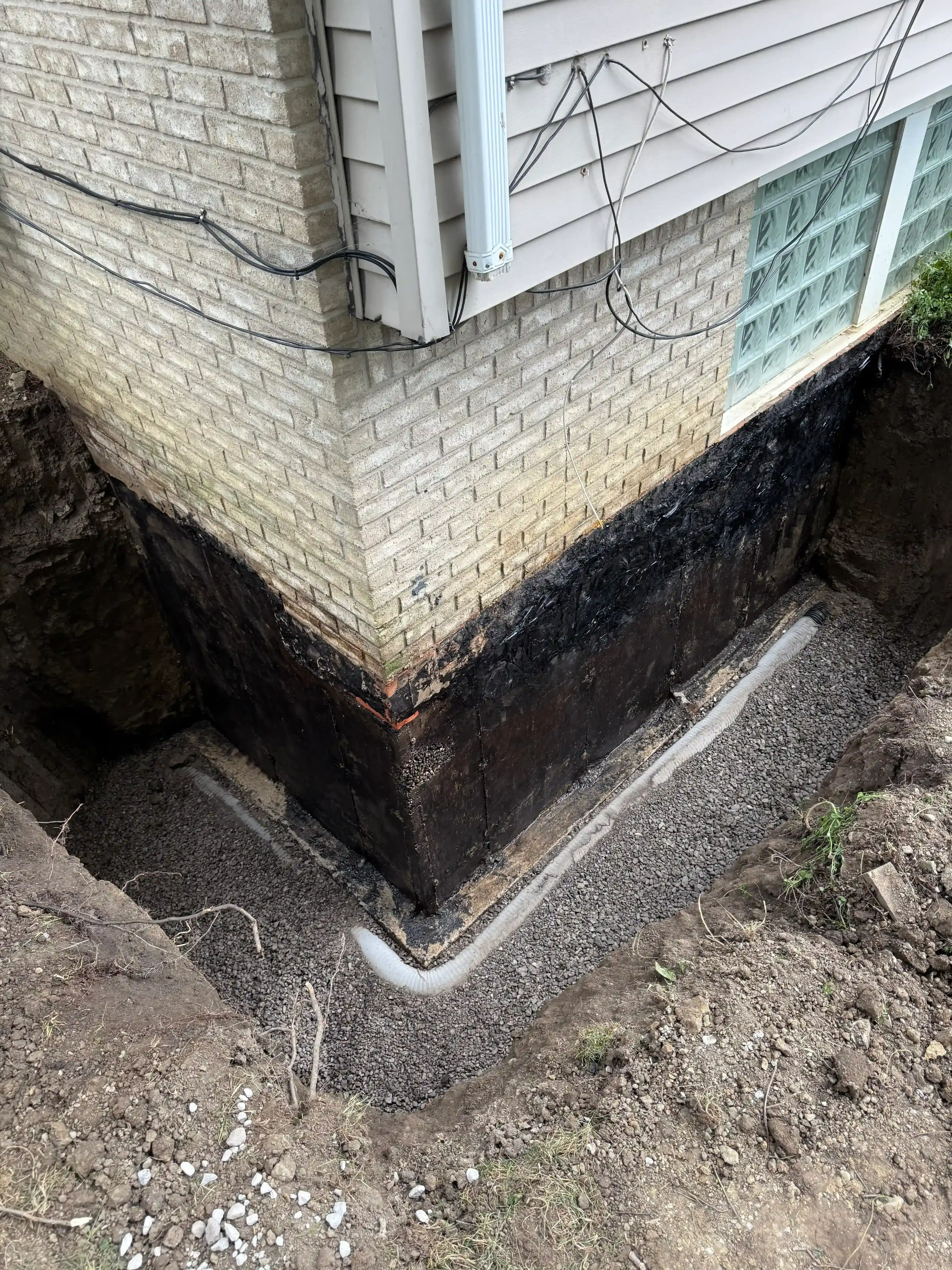 Exterior waterproofing with tar coating