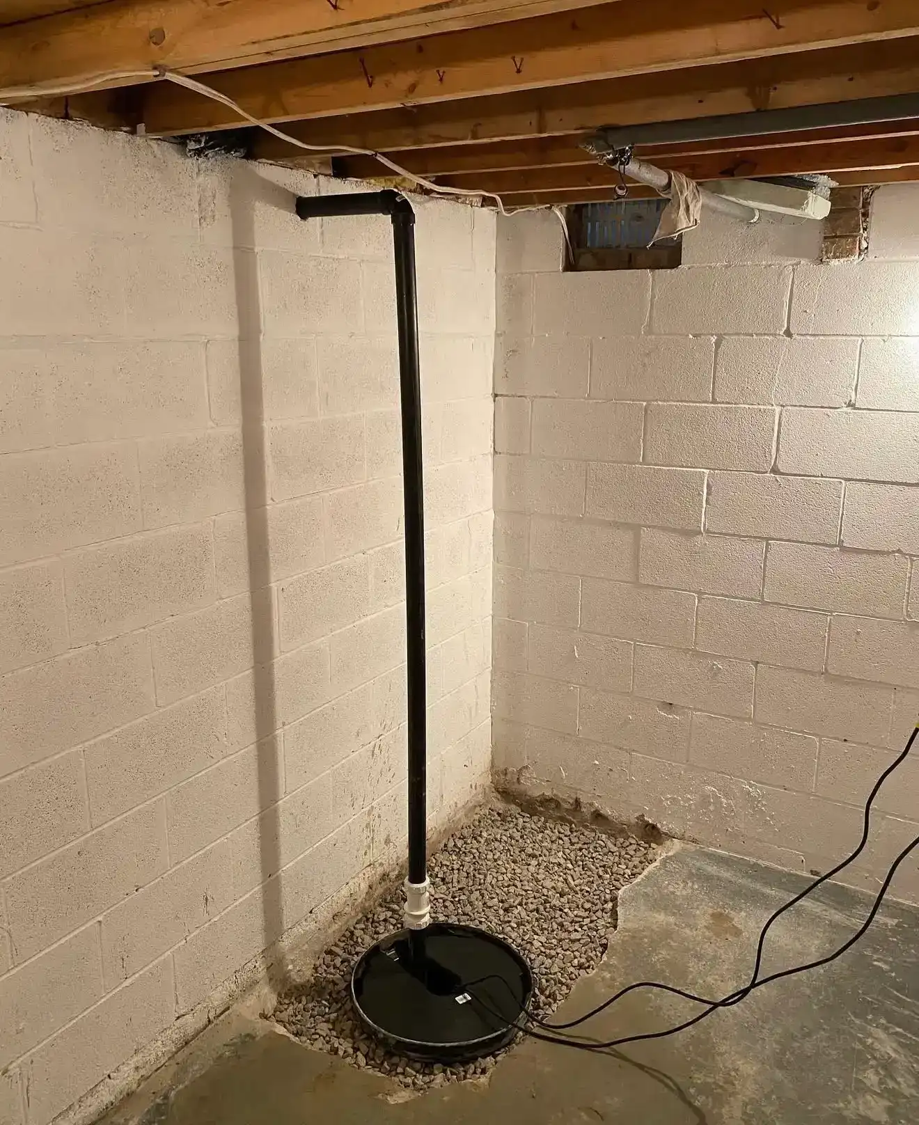 Sump pump corner installation
