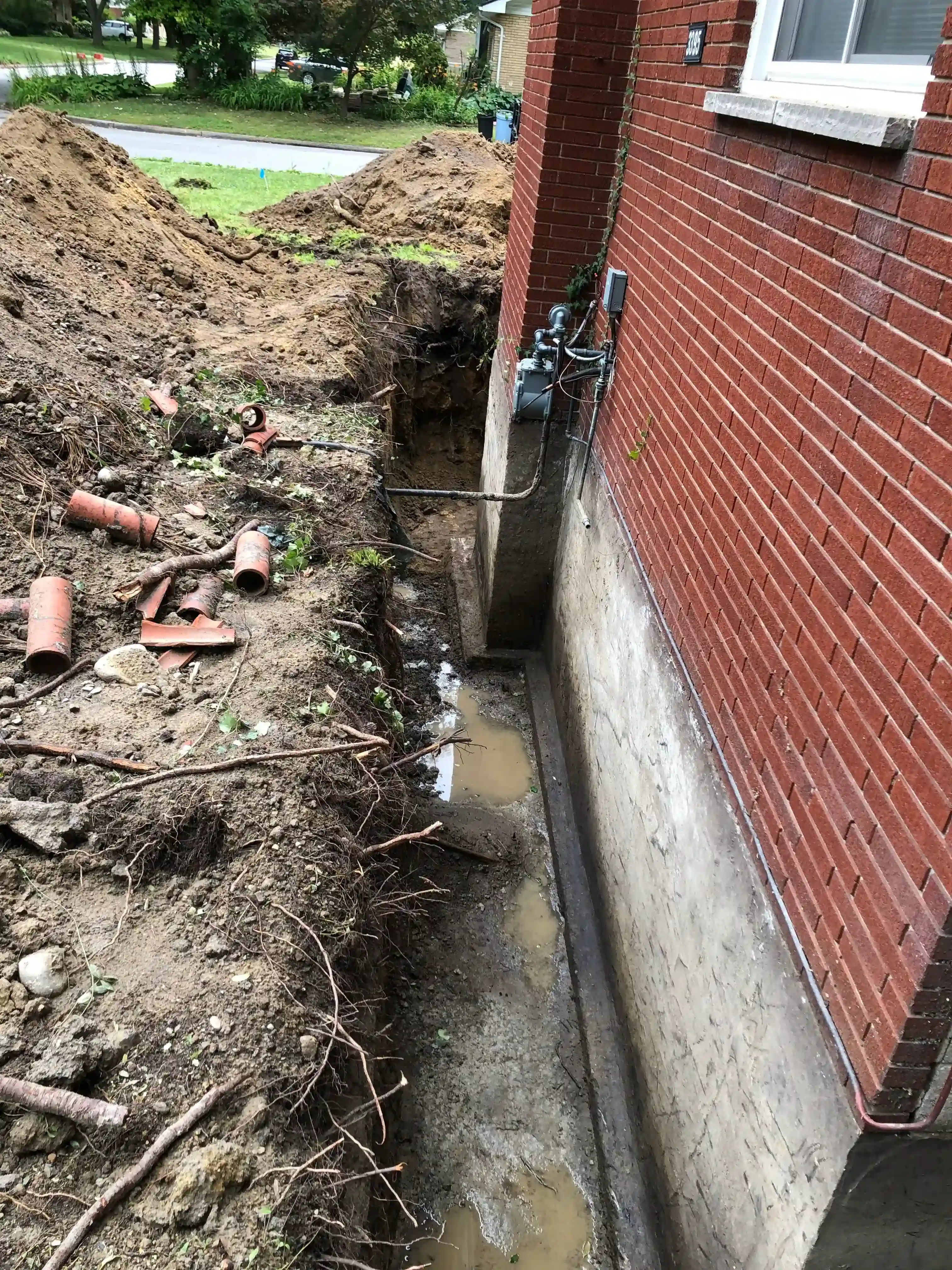 Excavation revealing old clay pipes