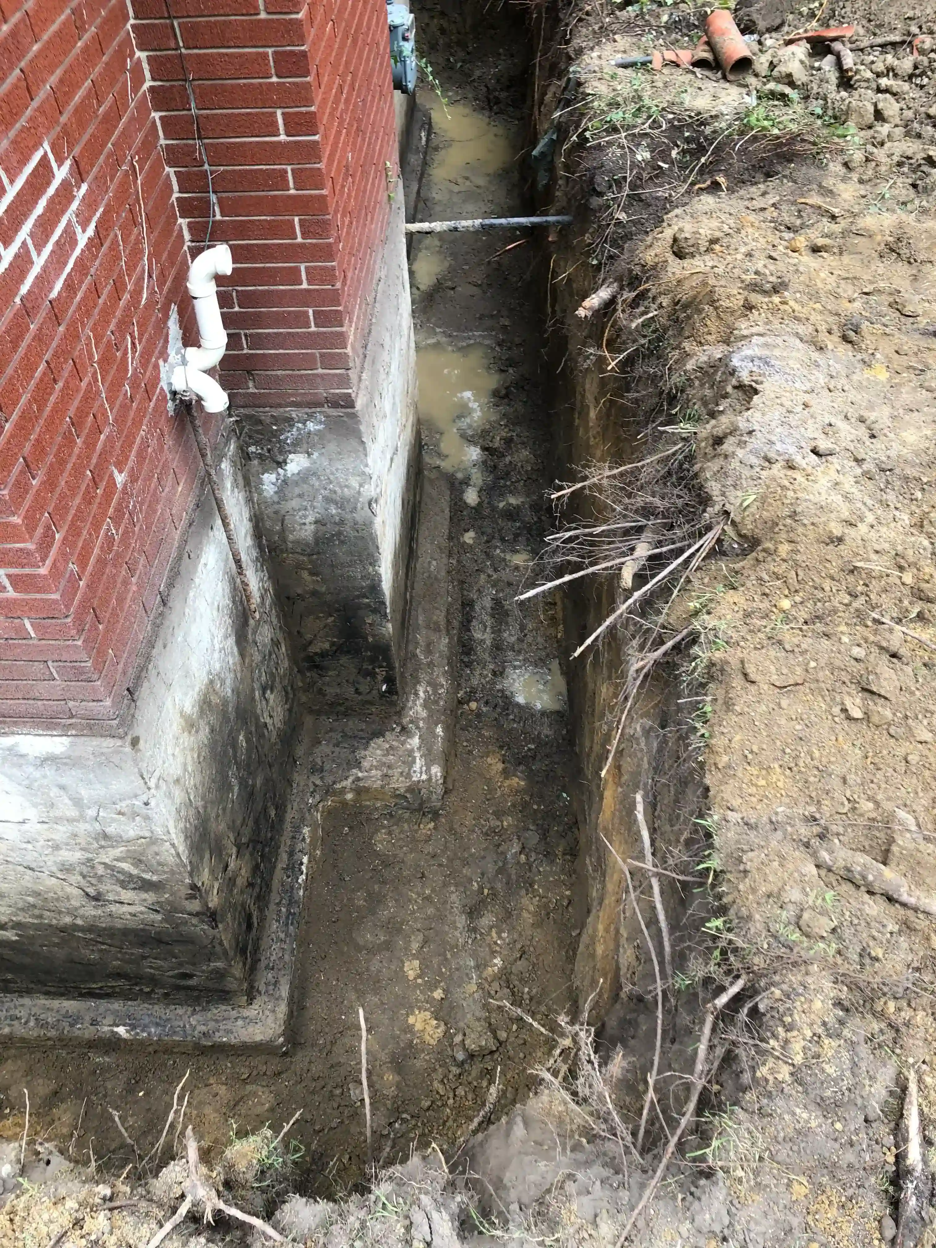 Foundation waterproofing in progress