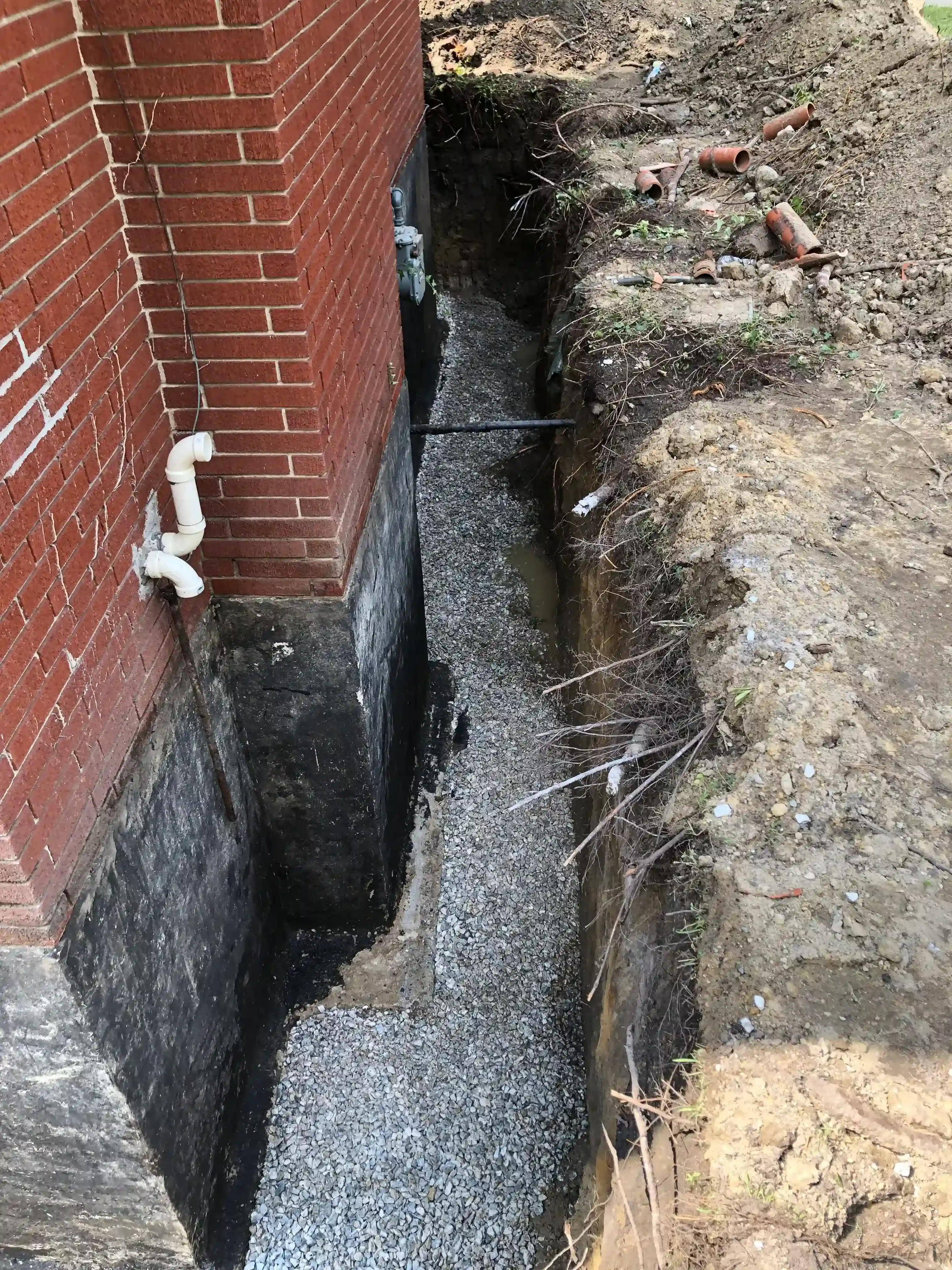 Exterior waterproofing with gravel drainage