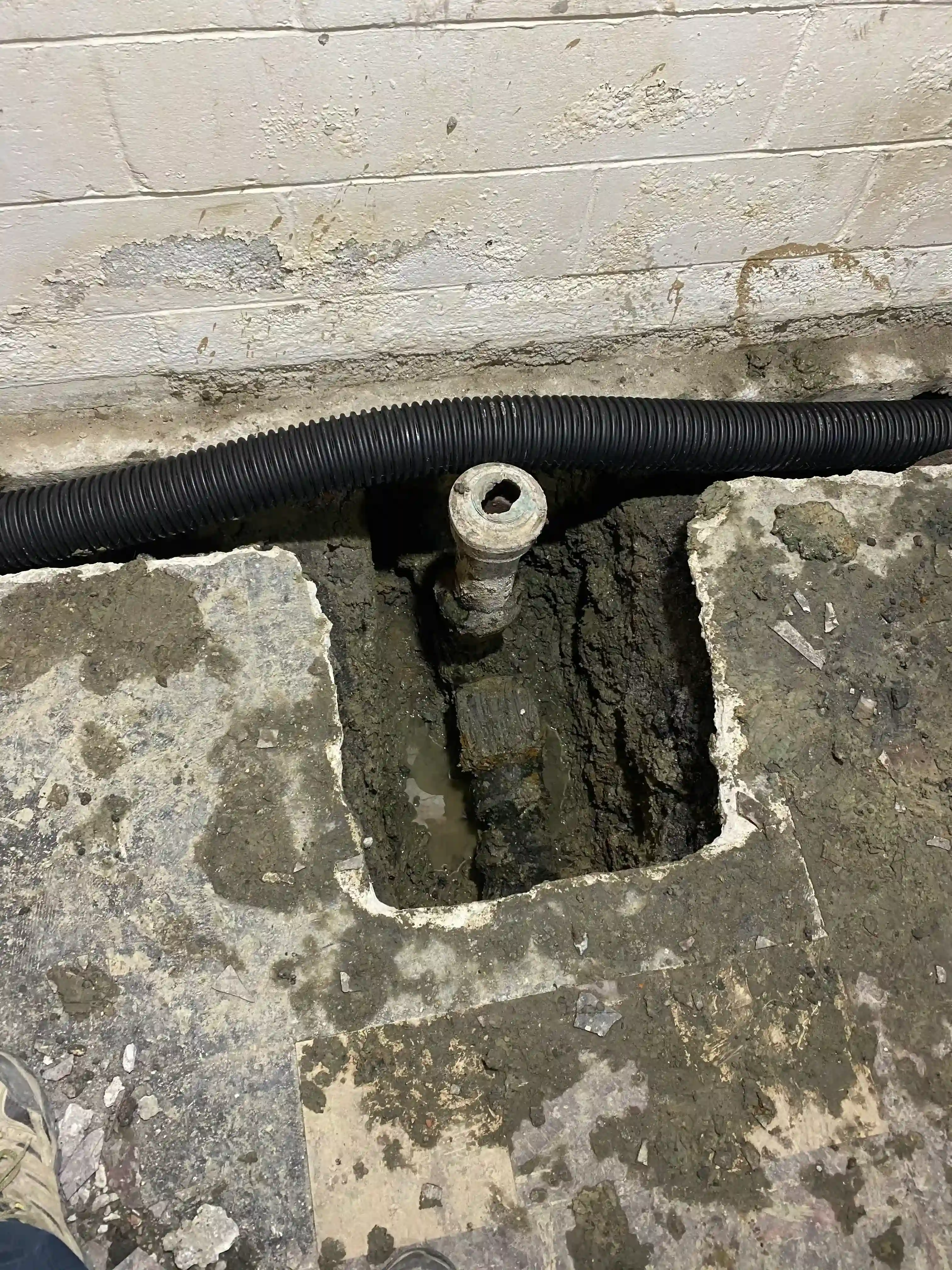 Sump pump discharge through wall